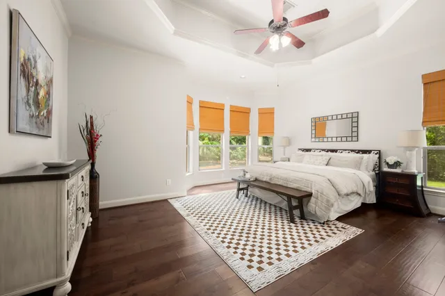 a bedroom with a bed rug and window