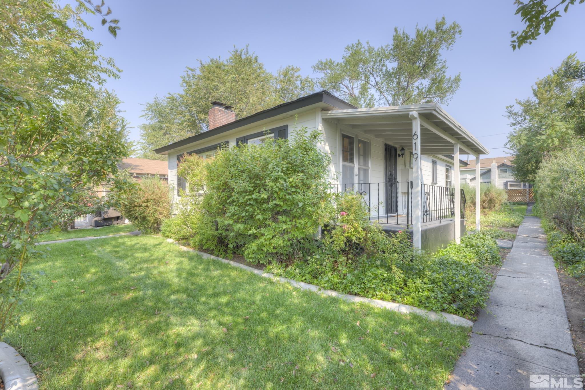 619 Thoma Street Reno, NV 89502 - Photo 1 of 40 a front view of a house with garden