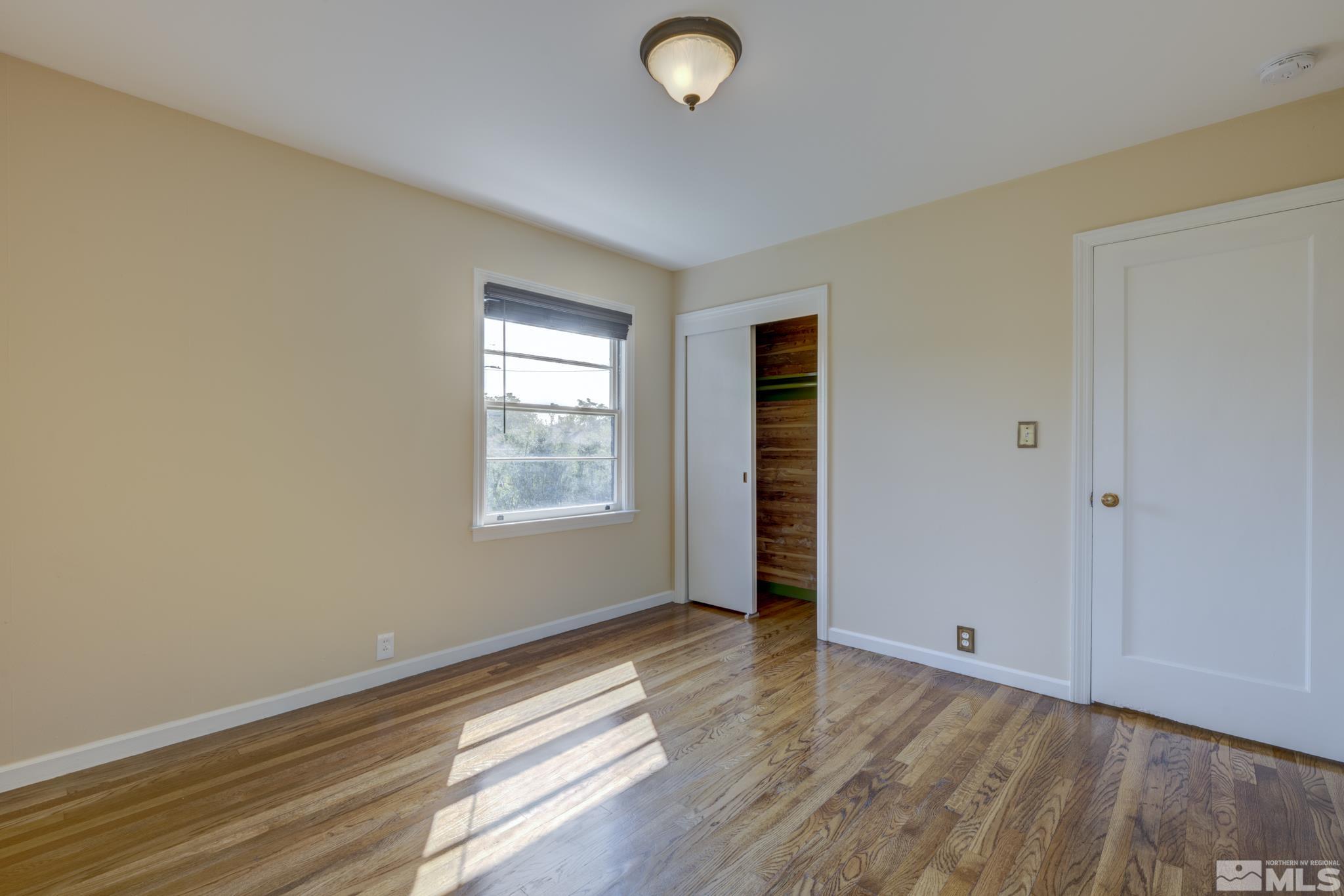 619 Thoma Street Reno, NV 89502 - Photo 12 of 40 a view of livingroom with hardwood floor and window