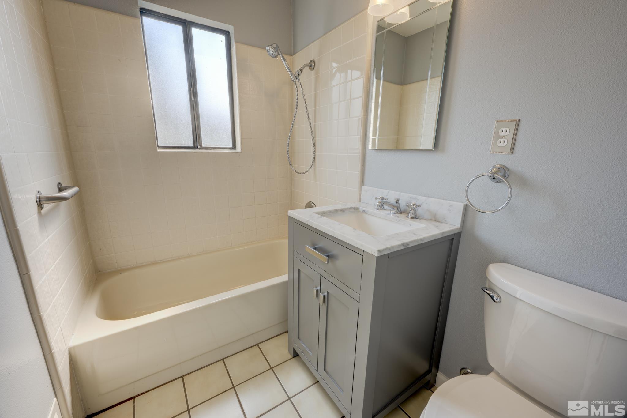 619 Thoma Street Reno, NV 89502 - Photo 13 of 40 a bathroom with a sink toilet and shower