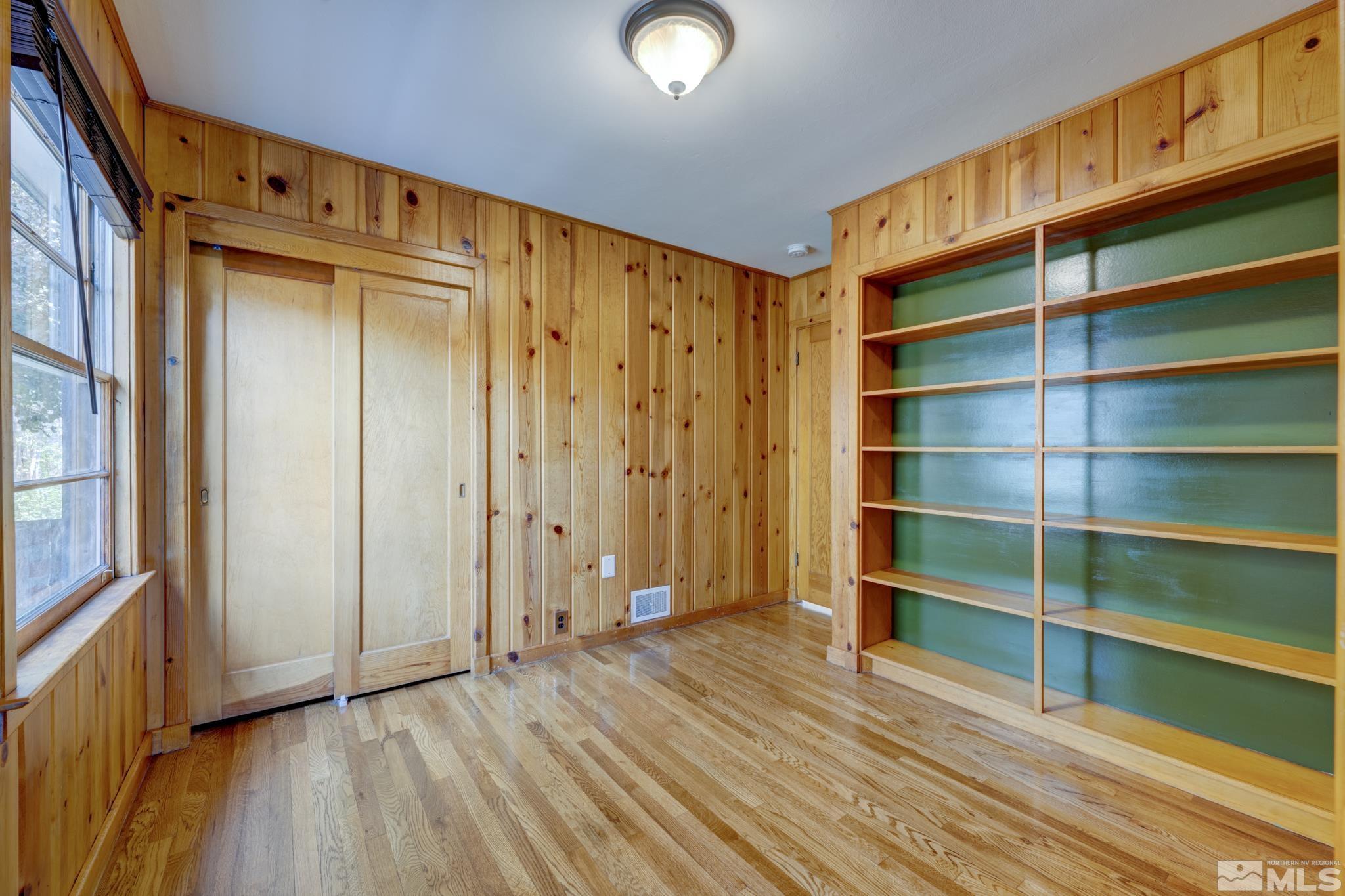 619 Thoma Street Reno, NV 89502 - Photo 14 of 40 a view of empty room with wooden floor and fan