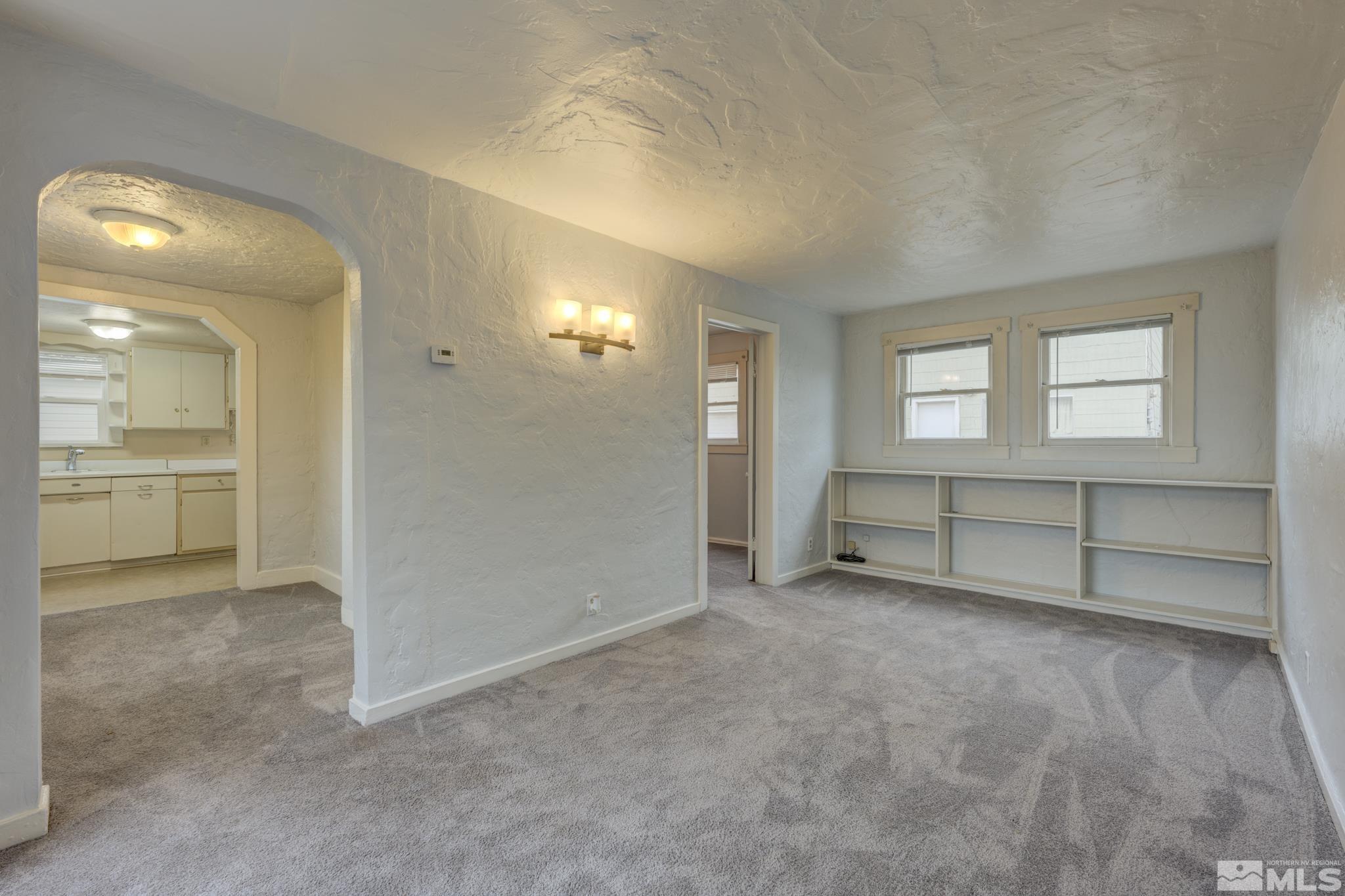 619 Thoma Street Reno, NV 89502 - Photo 18 of 40 an empty room with windows and bathroom view