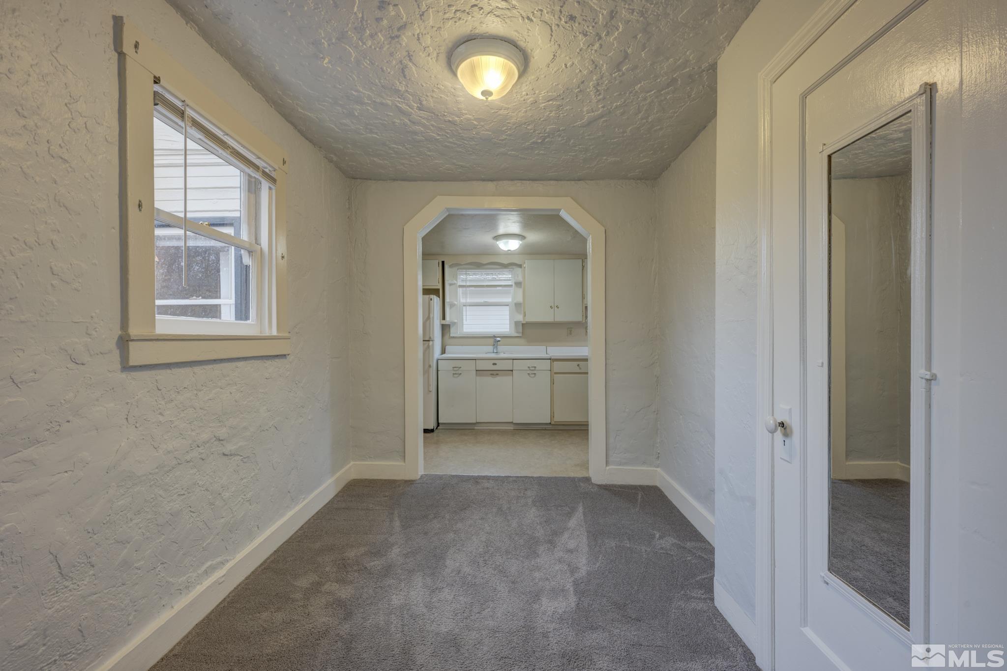 619 Thoma Street Reno, NV 89502 - Photo 20 of 40 an empty room with windows and cabinet