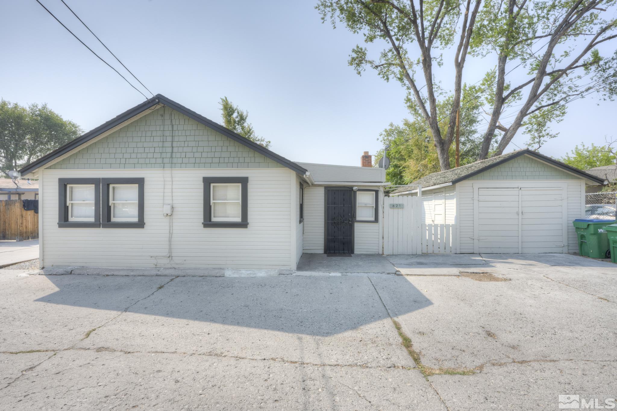 619 Thoma Street Reno, NV 89502 - Photo 2 of 40 a view of a house with a yard and large tree