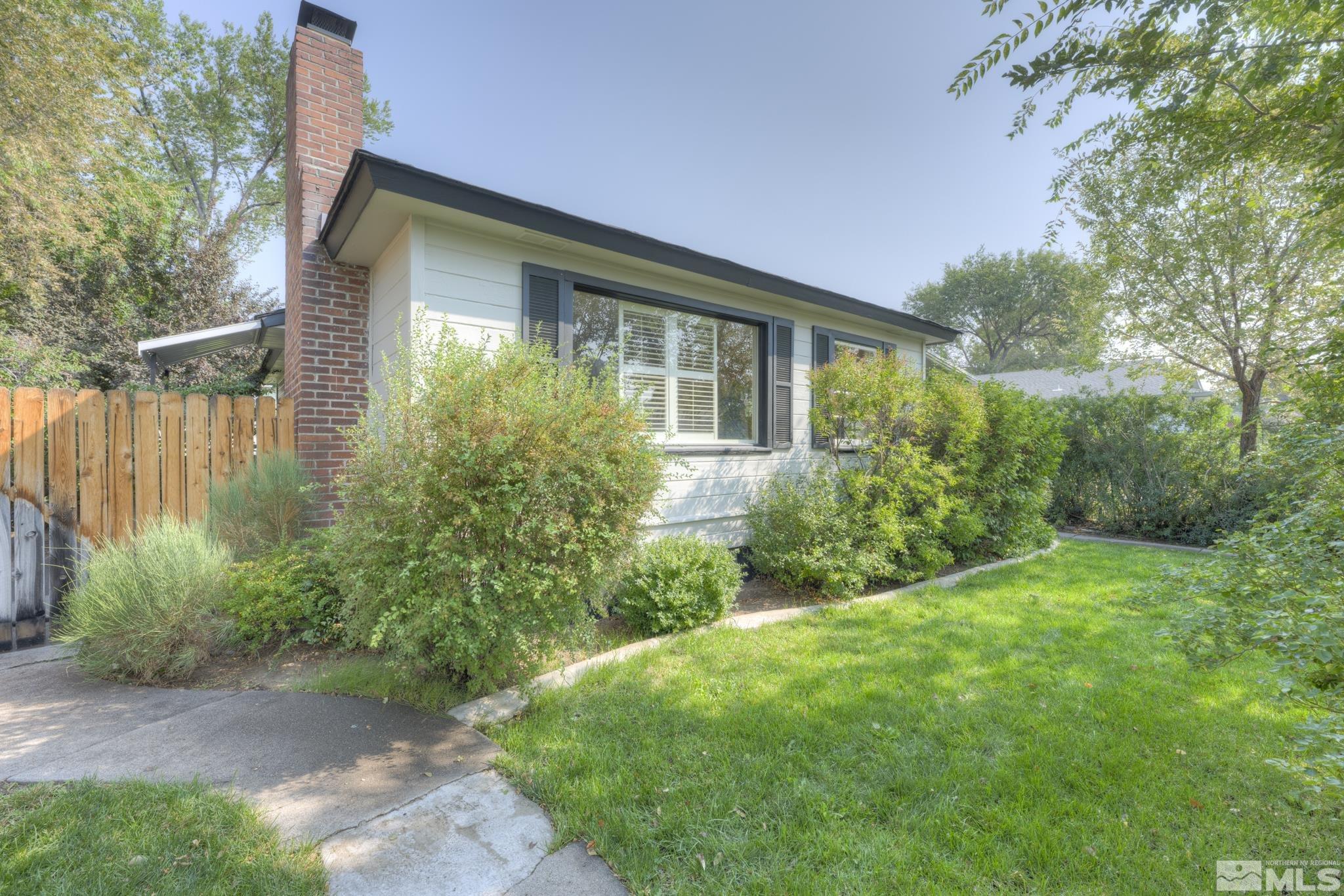 619 Thoma Street Reno, NV 89502 - Photo 24 of 40 a view of backyard with potted plants and large tree
