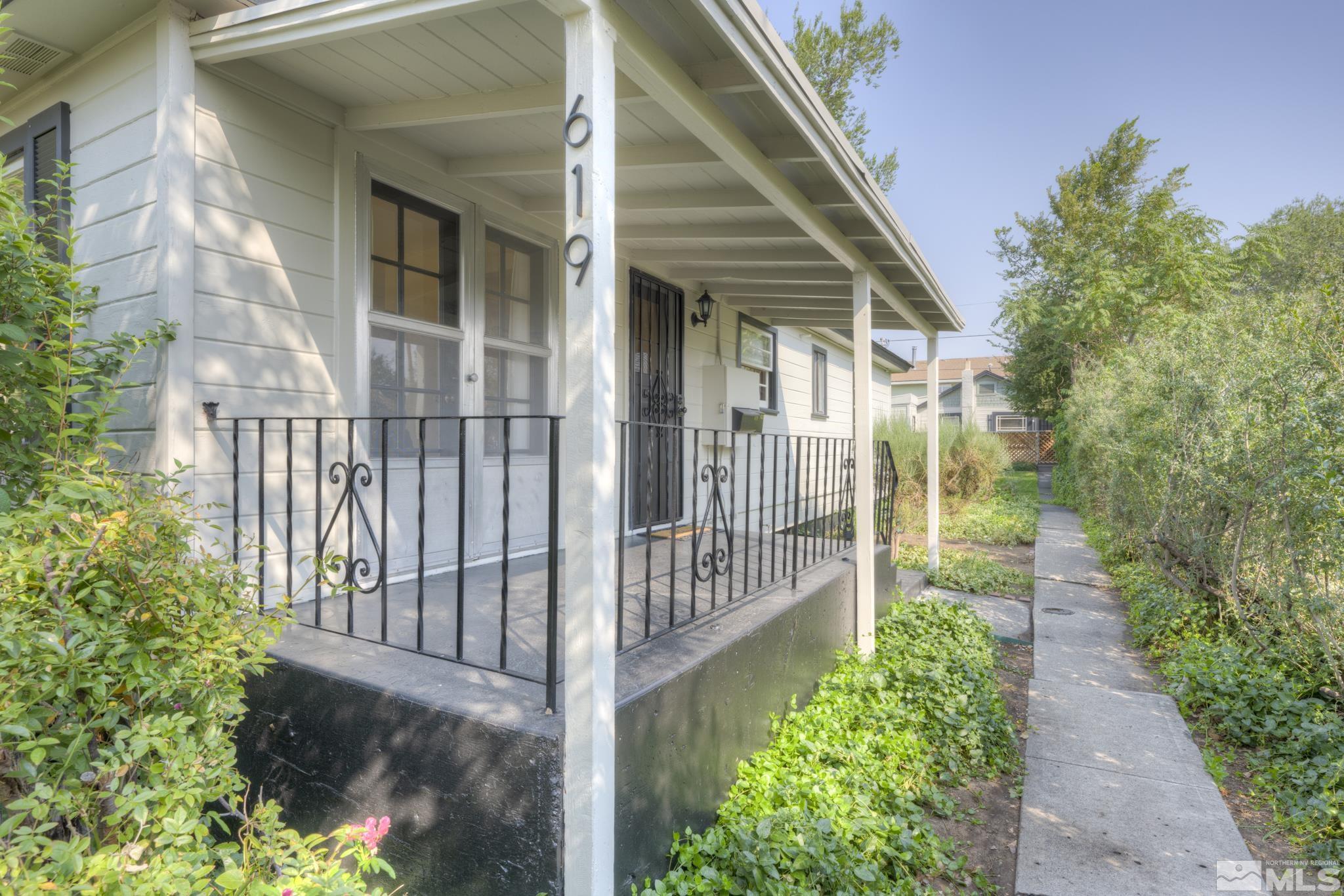 619 Thoma Street Reno, NV 89502 - Photo 26 of 40 a view of a pathway of a house with a small yard
