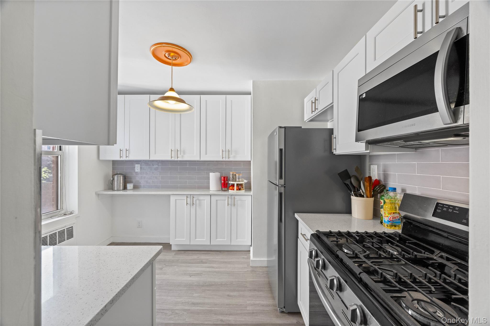 2736 Independence Avenue, Unit 4A Bronx, NY 10463 - Photo 1 of 31 a kitchen with stainless steel appliances granite countertop a refrigerator stove and microwave