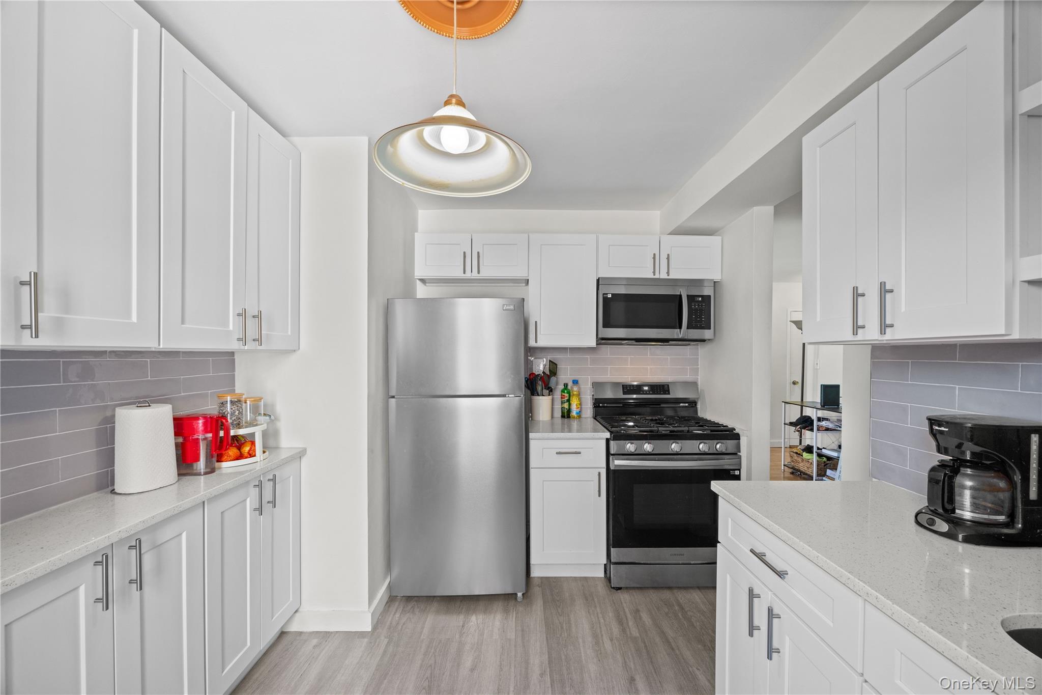 2736 Independence Avenue, Unit 4A Bronx, NY 10463 - Photo 11 of 31 a kitchen with stainless steel appliances a refrigerator stove and sink