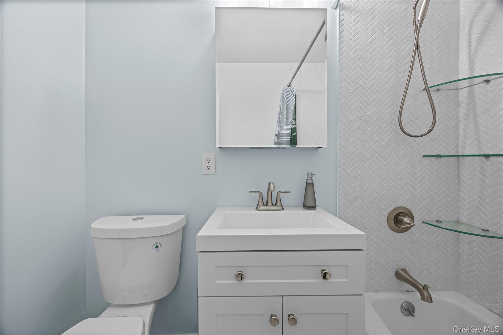 2736 Independence Avenue, Unit 4A Bronx, NY 10463 - Photo 14 of 31 a bathroom with a sink a toilet and shower