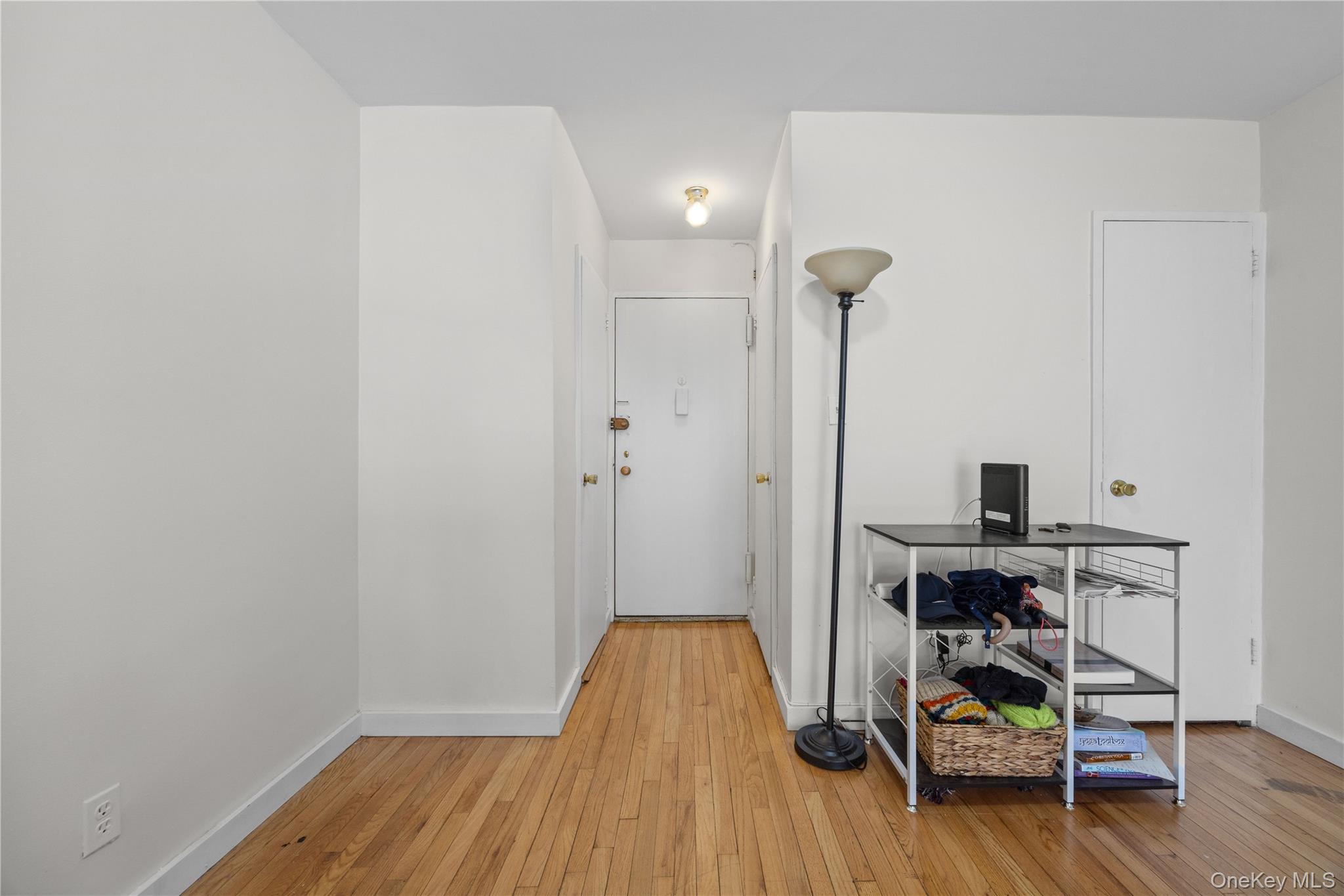 2736 Independence Avenue, Unit 4A Bronx, NY 10463 - Photo 16 of 31 a view of a room with wooden floor and a window