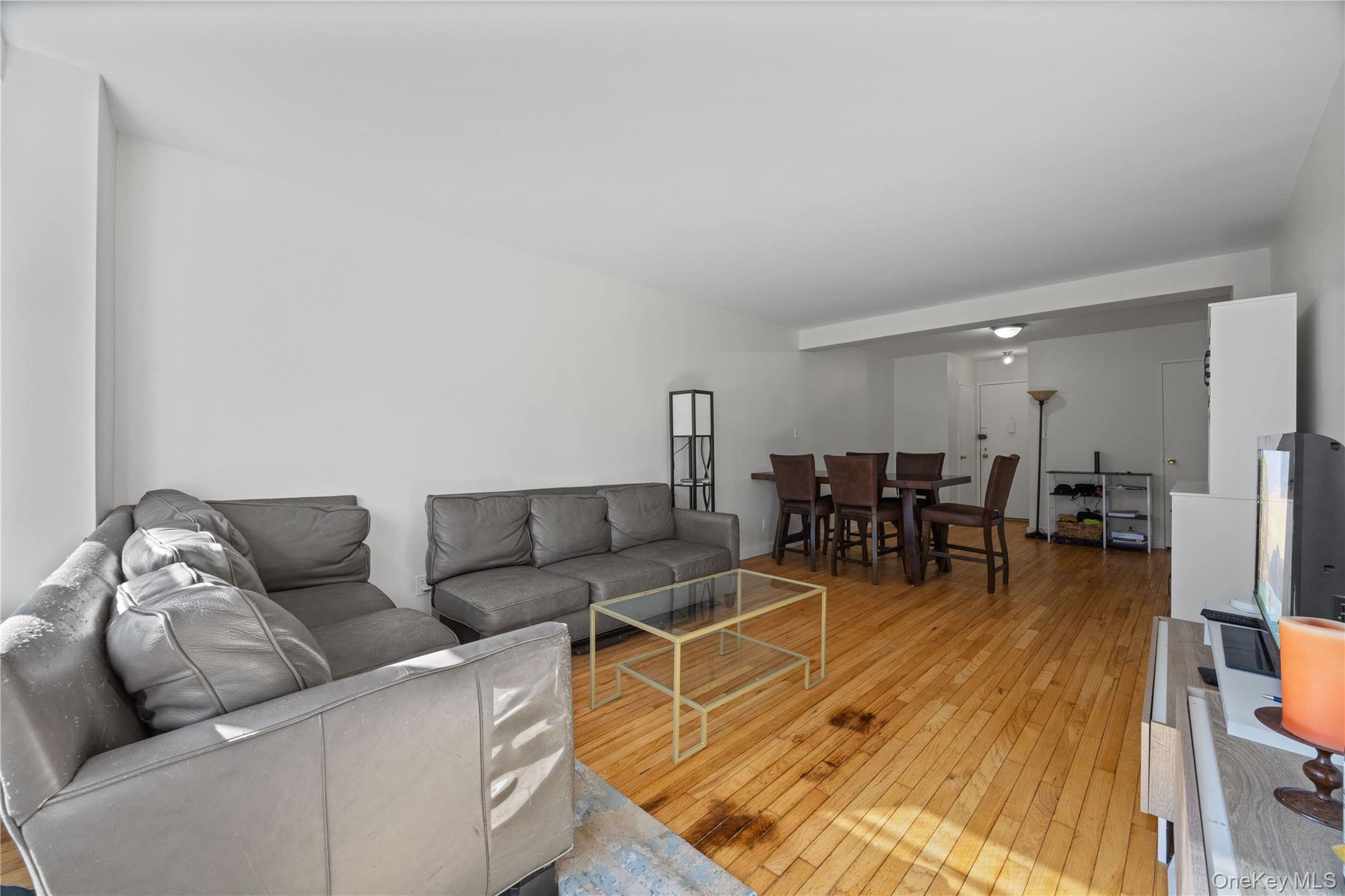 2736 Independence Avenue, Unit 4A Bronx, NY 10463 - Photo 21 of 31 a living room with furniture and a table