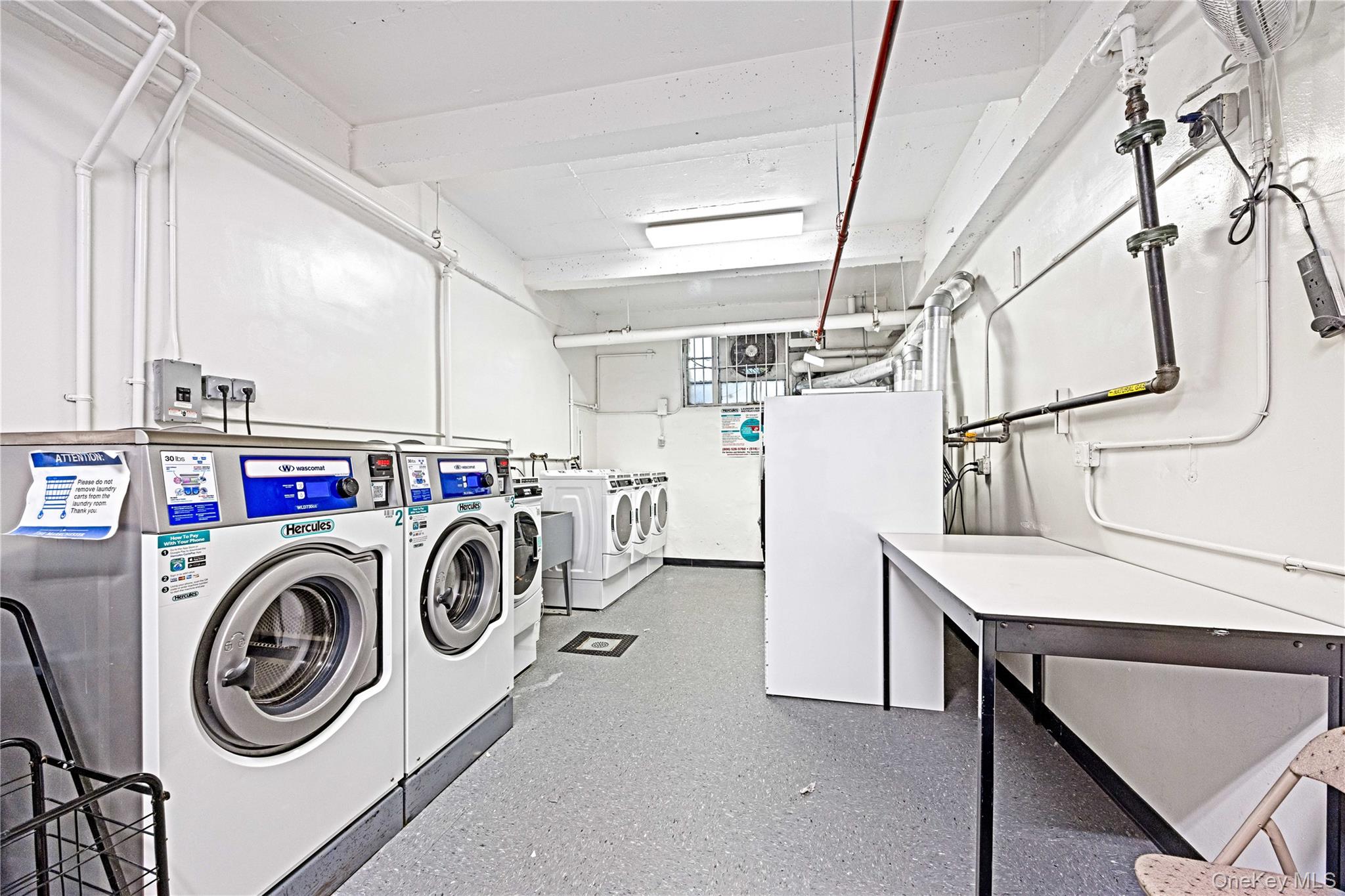 2736 Independence Avenue, Unit 4A Bronx, NY 10463 - Photo 25 of 31 a utility room with dryer and washer