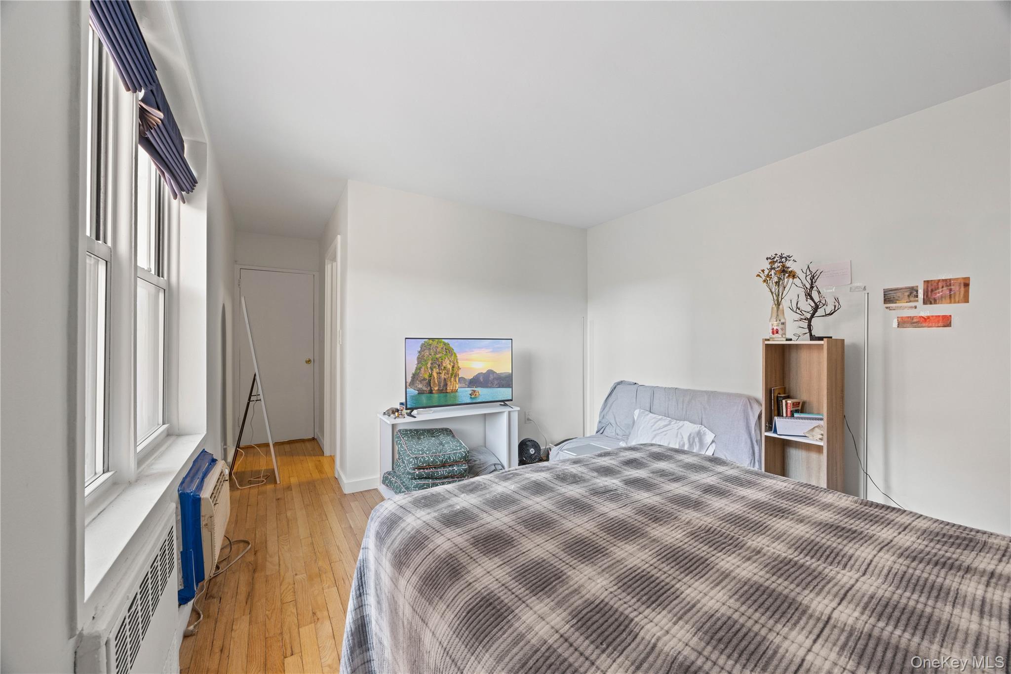 2736 Independence Avenue, Unit 4A Bronx, NY 10463 - Photo 7 of 31 a bedroom with a bed and a dresser