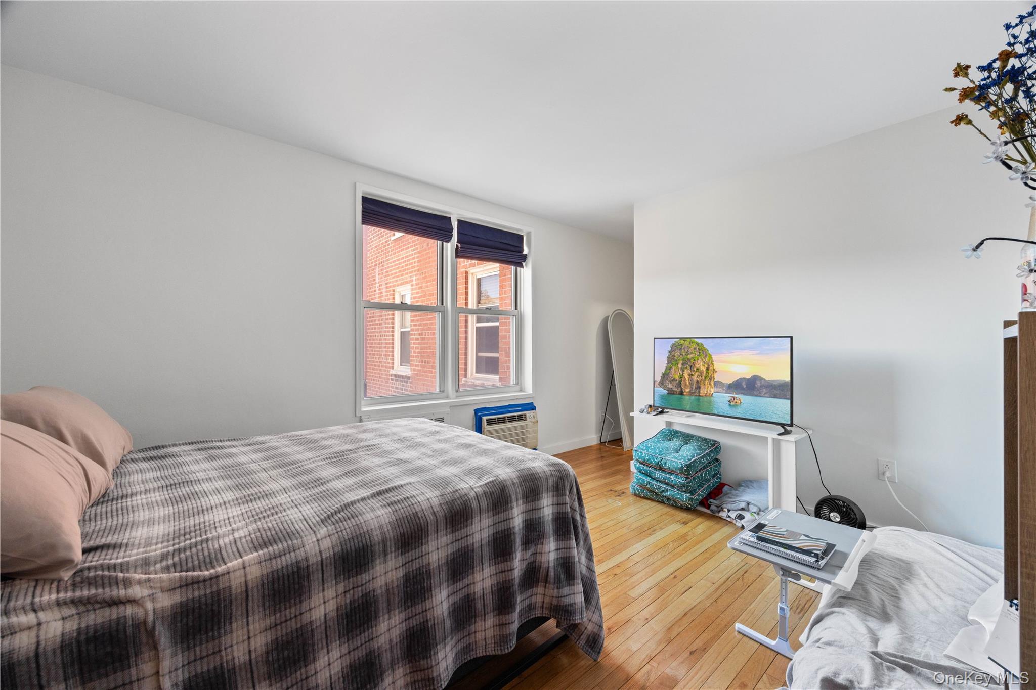 2736 Independence Avenue, Unit 4A Bronx, NY 10463 - Photo 8 of 31 a bedroom with a bed and window