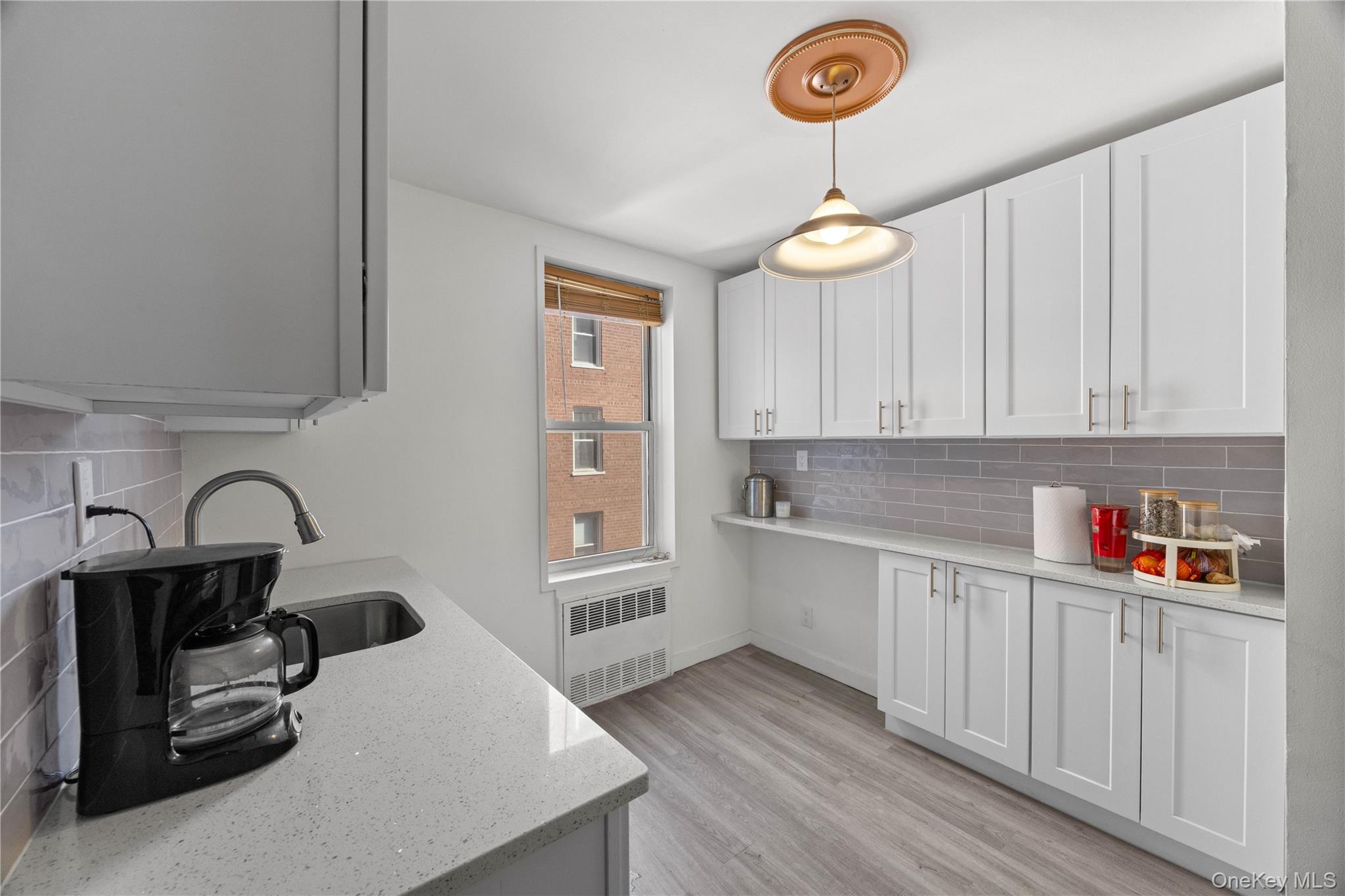 2736 Independence Avenue, Unit 4A Bronx, NY 10463 - Photo 9 of 31 a kitchen with a refrigerator and a stove top oven