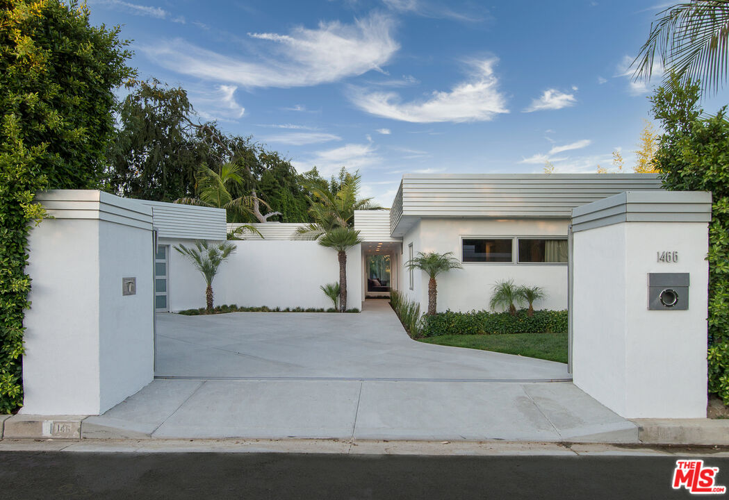 1466 Bel Air Road Los Angeles, CA 90077 - Photo 32 of 35 front view of a house with a garage
