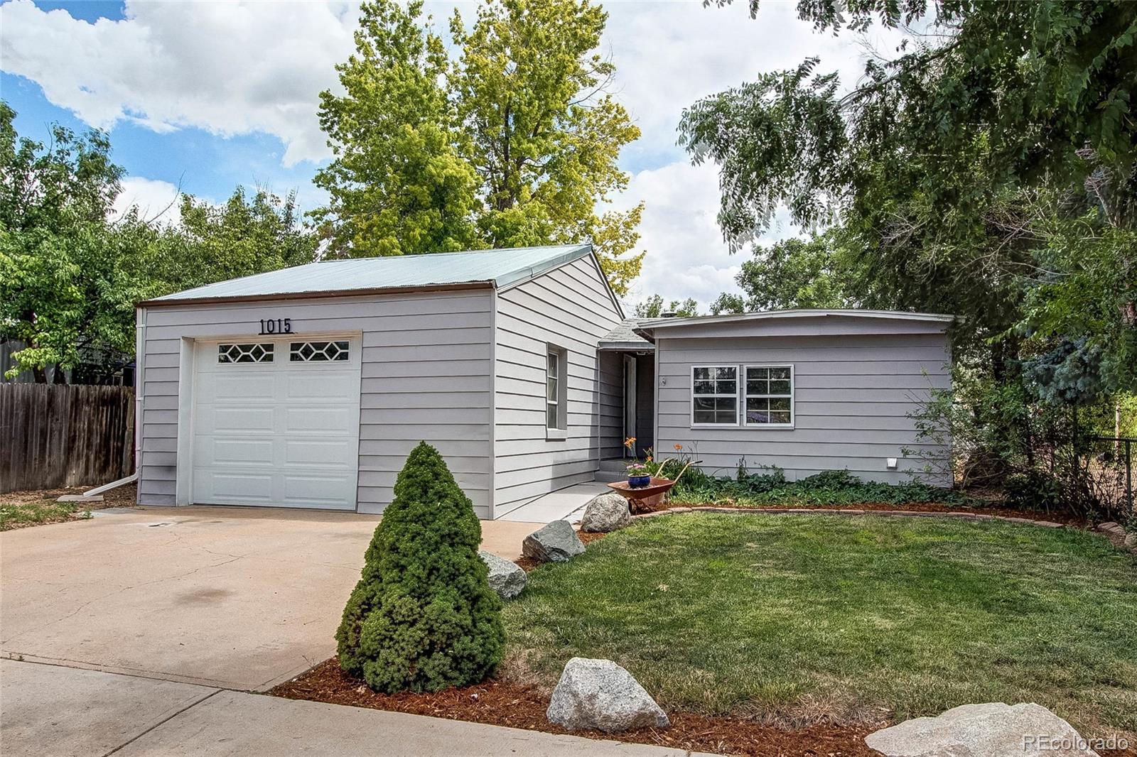 1015 Mac Davidson Circle Dacono, CO 80514 - Photo 2 of 22 a view of backyard of house and trees