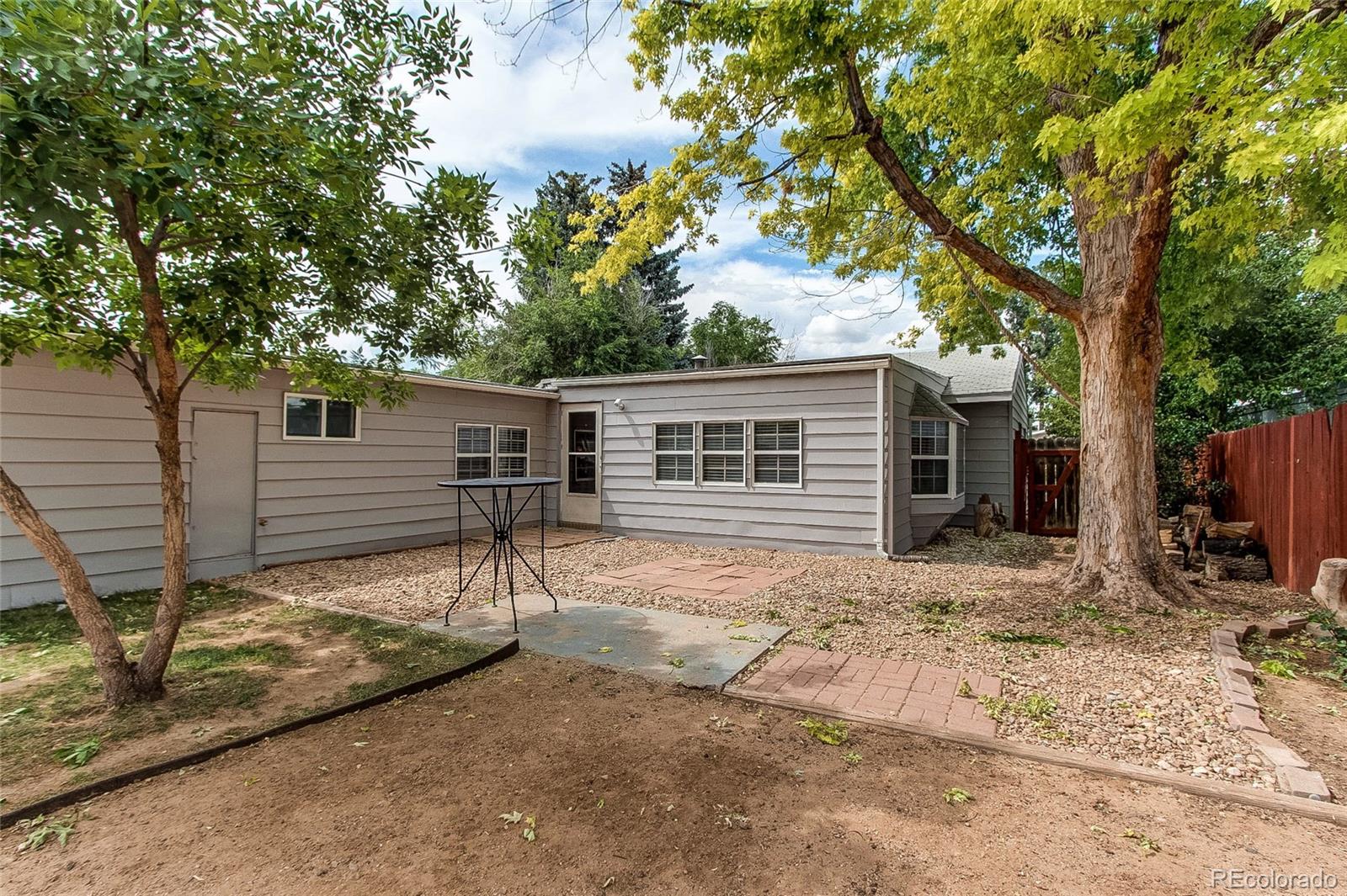 1015 Mac Davidson Circle Dacono, CO 80514 - Photo 22 of 22 a view of a house with a tree in the background