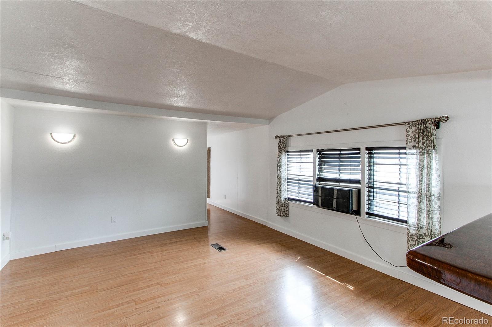 1015 Mac Davidson Circle Dacono, CO 80514 - Photo 8 of 22 a view of a room with natural light