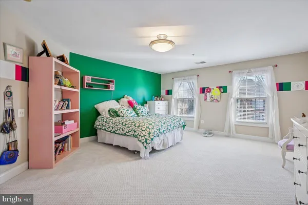 a bedroom with furniture and a bed