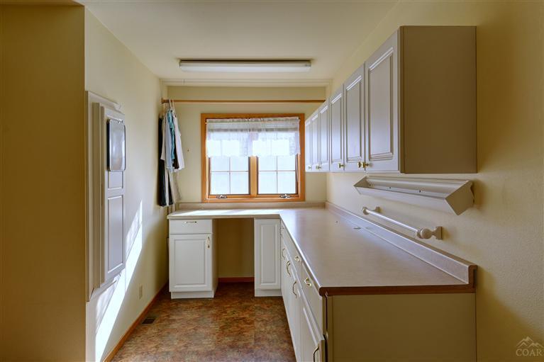 63578 Boyd Acres Road Bend, OR 97701 - Photo 20 of 22 a storage room with a washer and dryer