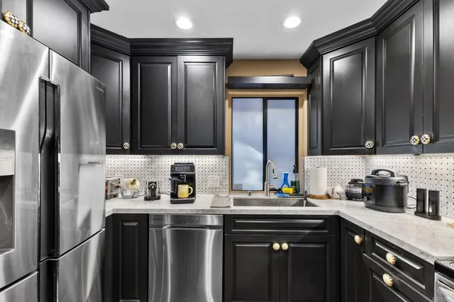 a living room with furniture and a lamp