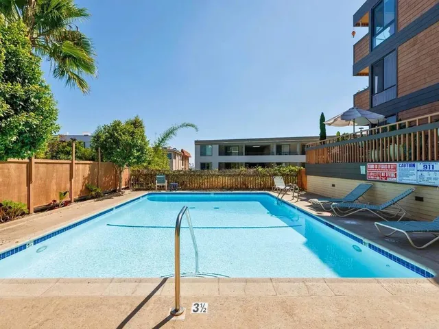 an aerial view of a houses with ocean view
