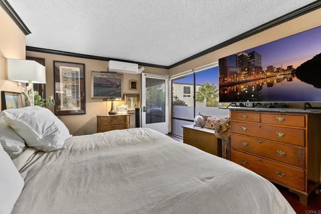 a bathroom with a granite countertop sink toilet mirror and shower