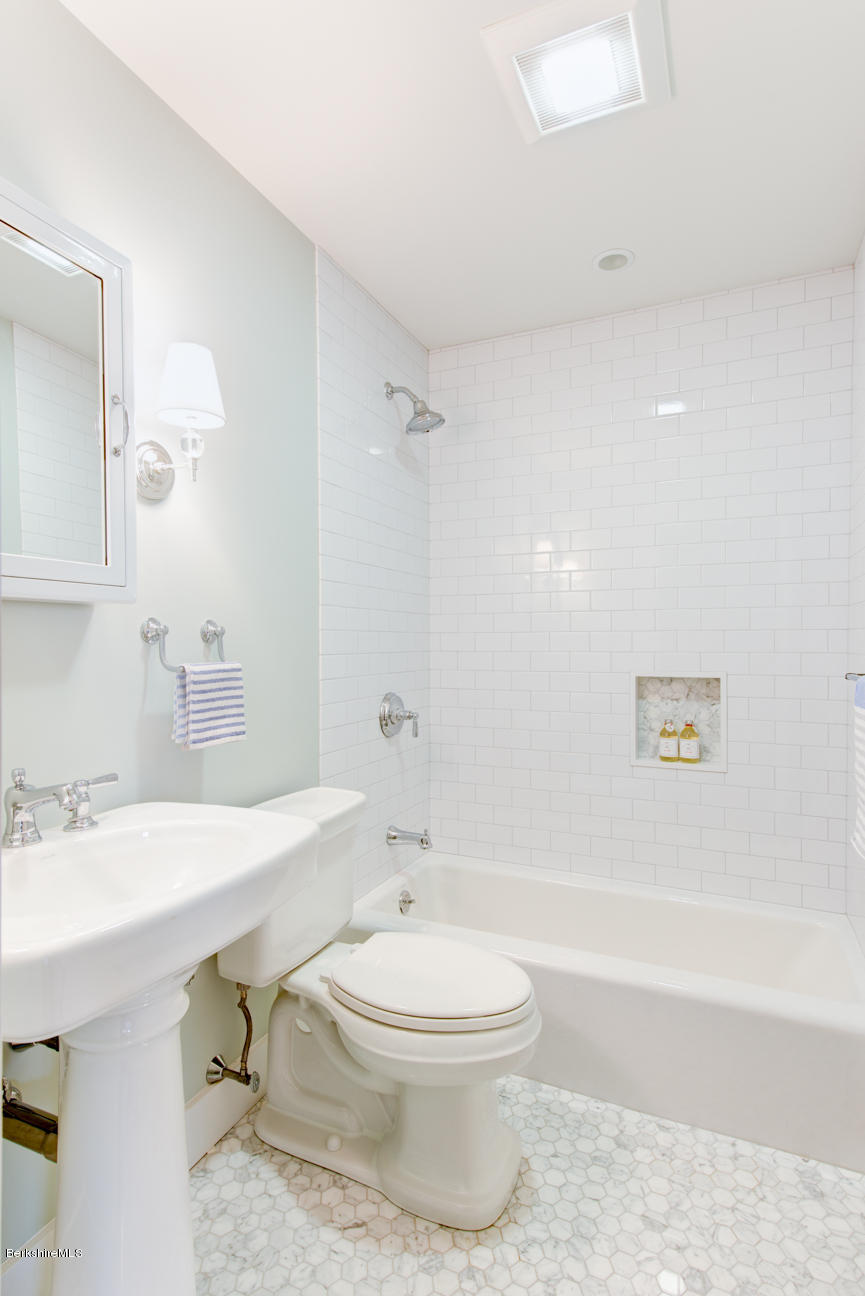 11 Prospect Hill Road, Unit B Stockbridge, MA 01262 - Photo 11 of 13 a bathroom with a sink a toilet and a bathtub