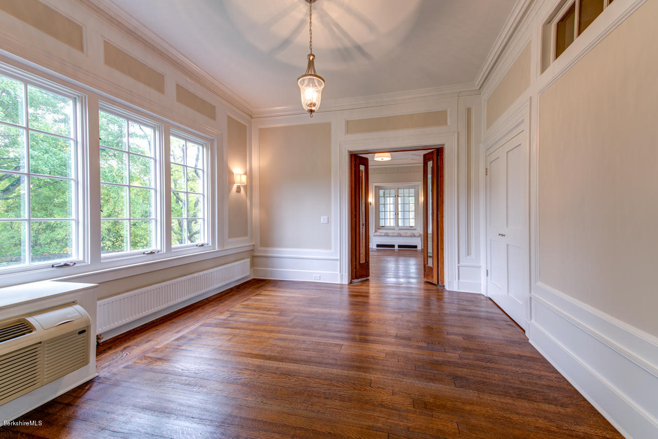 11 Prospect Hill Road, Unit B Stockbridge, MA 01262 - Photo 7 of 13 a view of an empty room with window and wooden floor