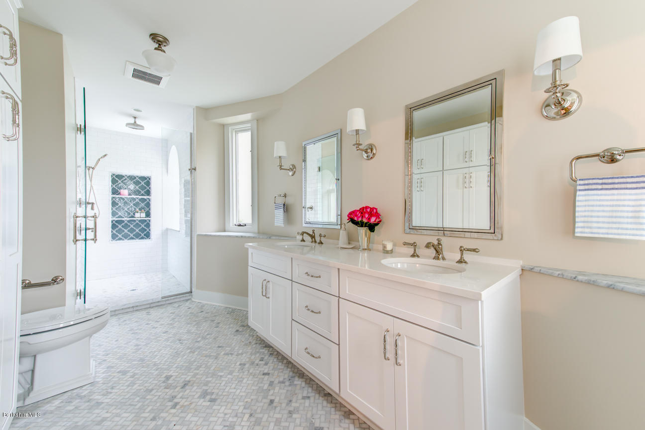 11 Prospect Hill Road, Unit B Stockbridge, MA 01262 - Photo 9 of 13 a bathroom with a sink vanity granite tub shower and a mirror