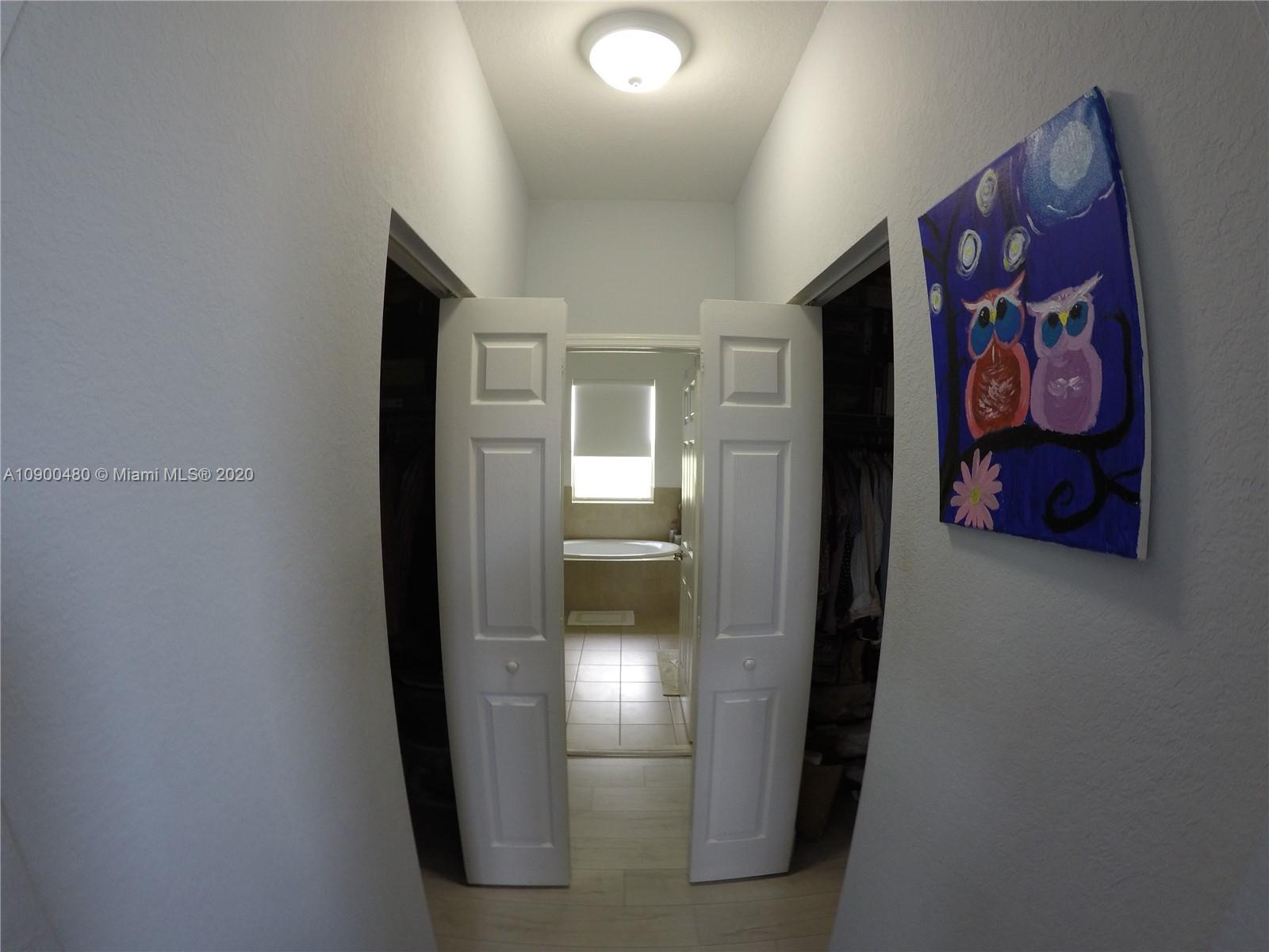 9458 Southwest 170th Path Miami, FL 33196 - Photo 33 of 97 His and hers walking closets.