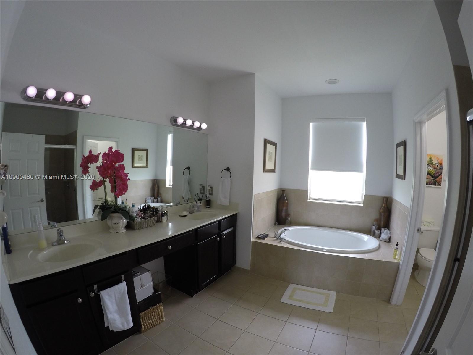 9458 Southwest 170th Path Miami, FL 33196 - Photo 5 of 97 Master Bathroom with 2 sinks, separate tub and shower.