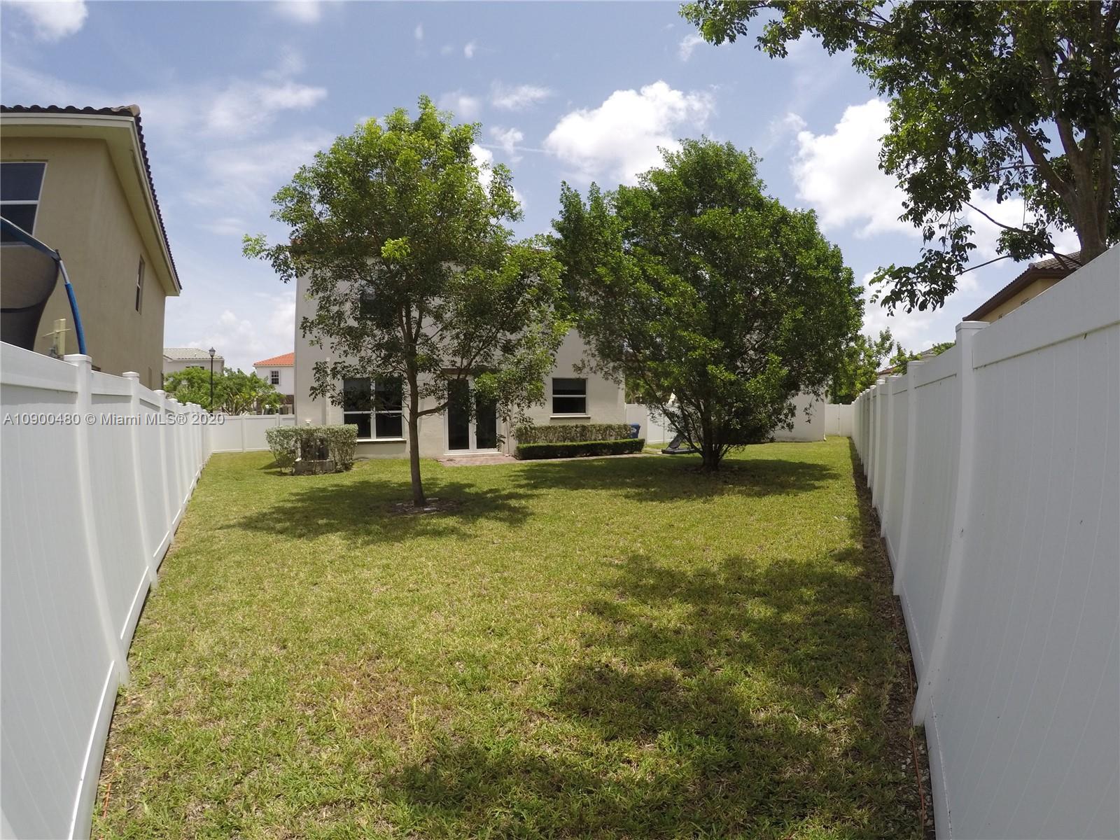 9458 Southwest 170th Path Miami, FL 33196 - Photo 57 of 97 patio from further angle. House on the left and studio on the far right.