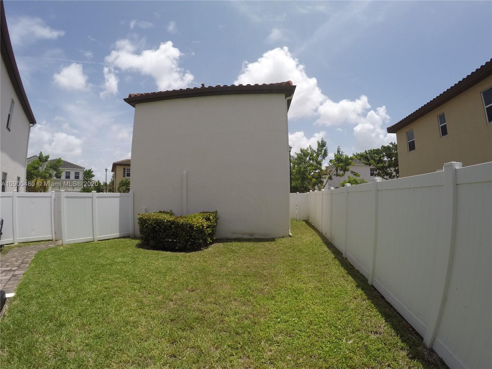 9458 Southwest 170th Path Miami, FL 33196 - Photo 61 of 97 one of the entrance to patio on the middle with pavers. Studio apt on the right.
