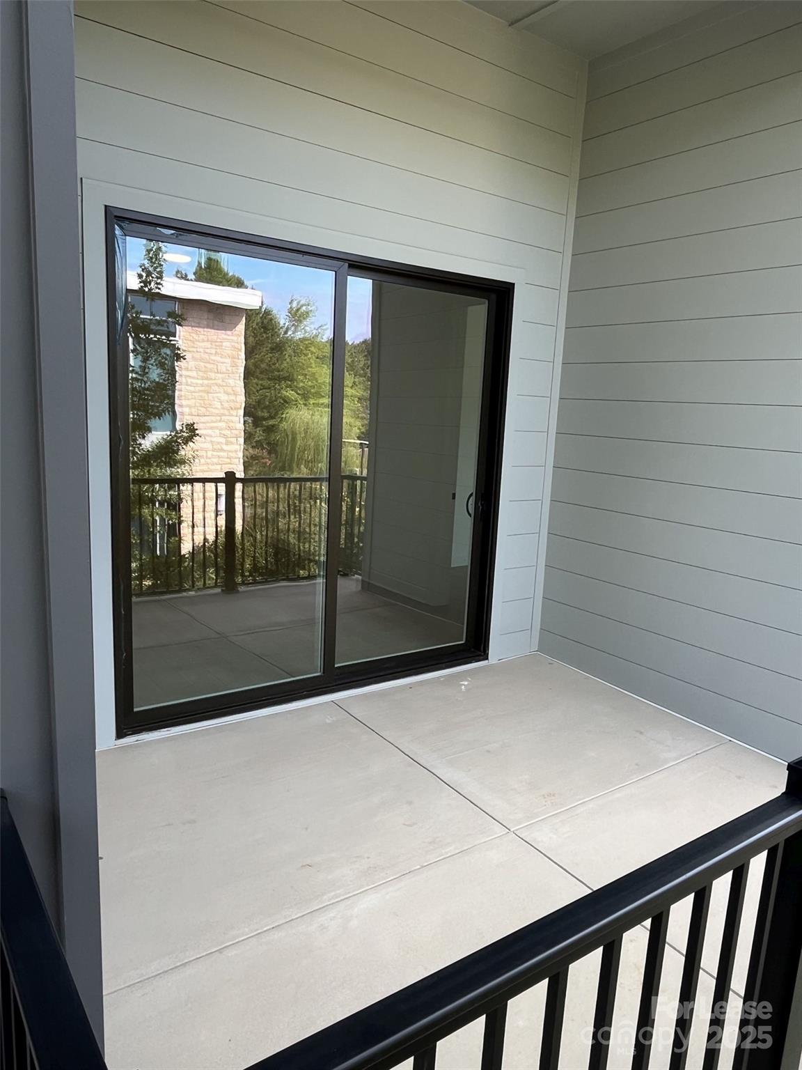 19546 Greentree Way, Unit 202 Cornelius, NC 28031 - Photo 18 of 30 a bedroom with a bed and a window
