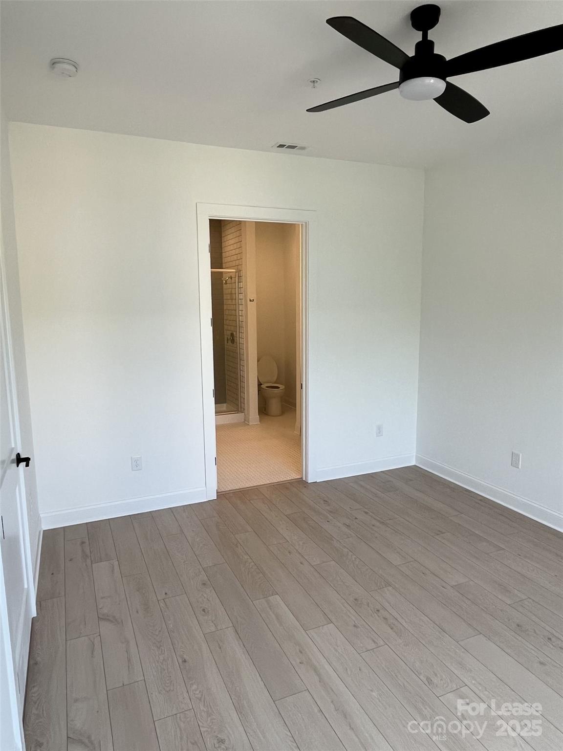 19546 Greentree Way, Unit 202 Cornelius, NC 28031 - Photo 20 of 30 a view of a big room with wooden floor