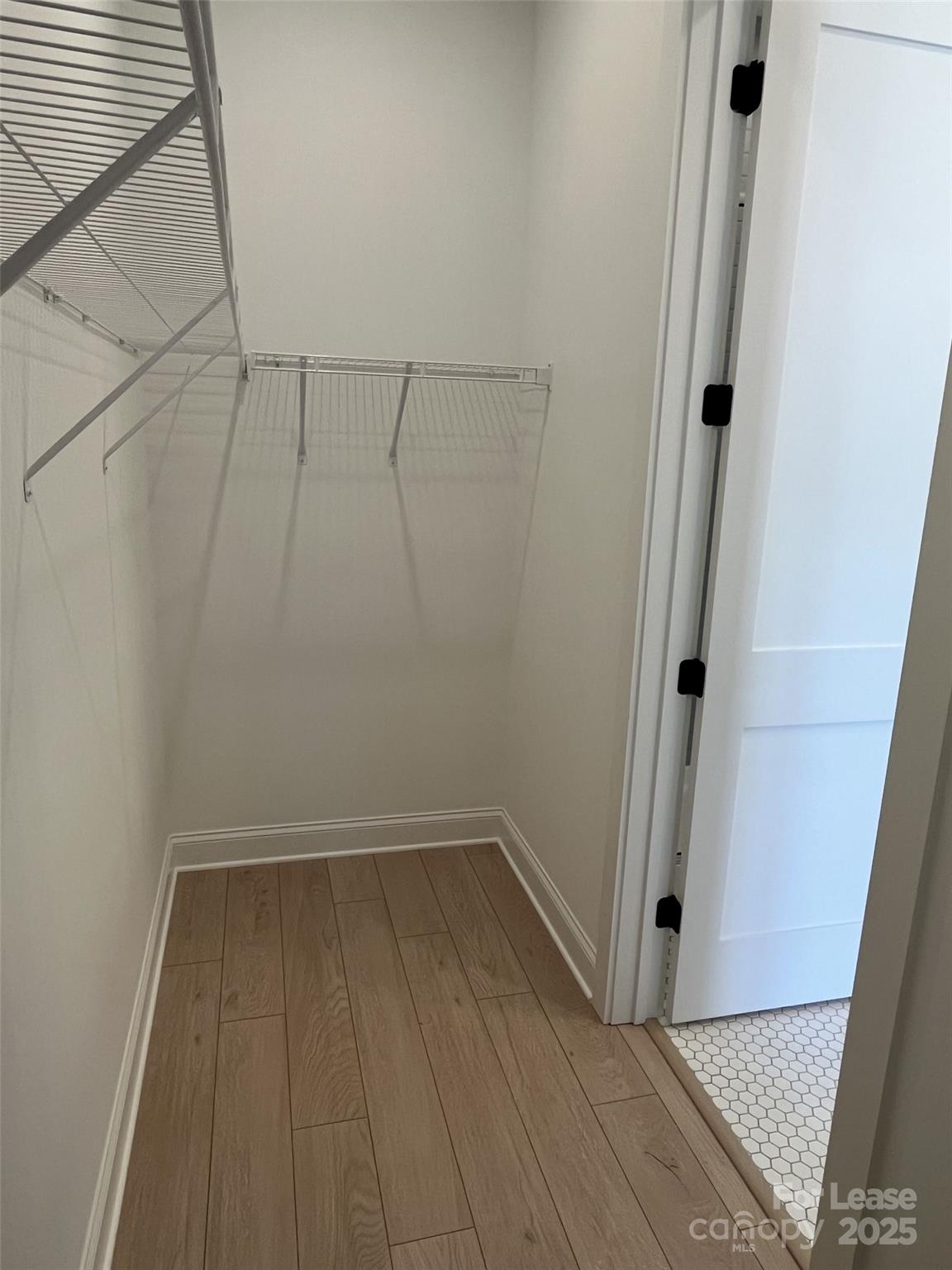 19546 Greentree Way, Unit 202 Cornelius, NC 28031 - Photo 23 of 30 a view of a room with wooden floor