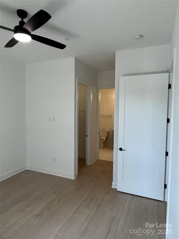 a bathroom with a sink vanity mirror and toilet
