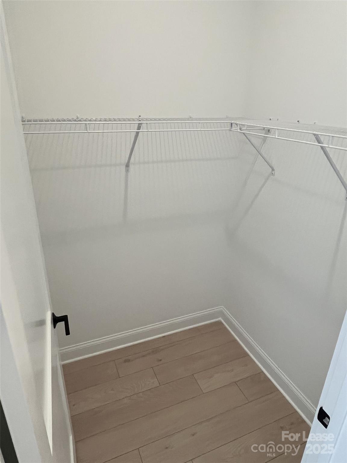 19546 Greentree Way, Unit 202 Cornelius, NC 28031 - Photo 26 of 30 a view of a room with racks on the wall