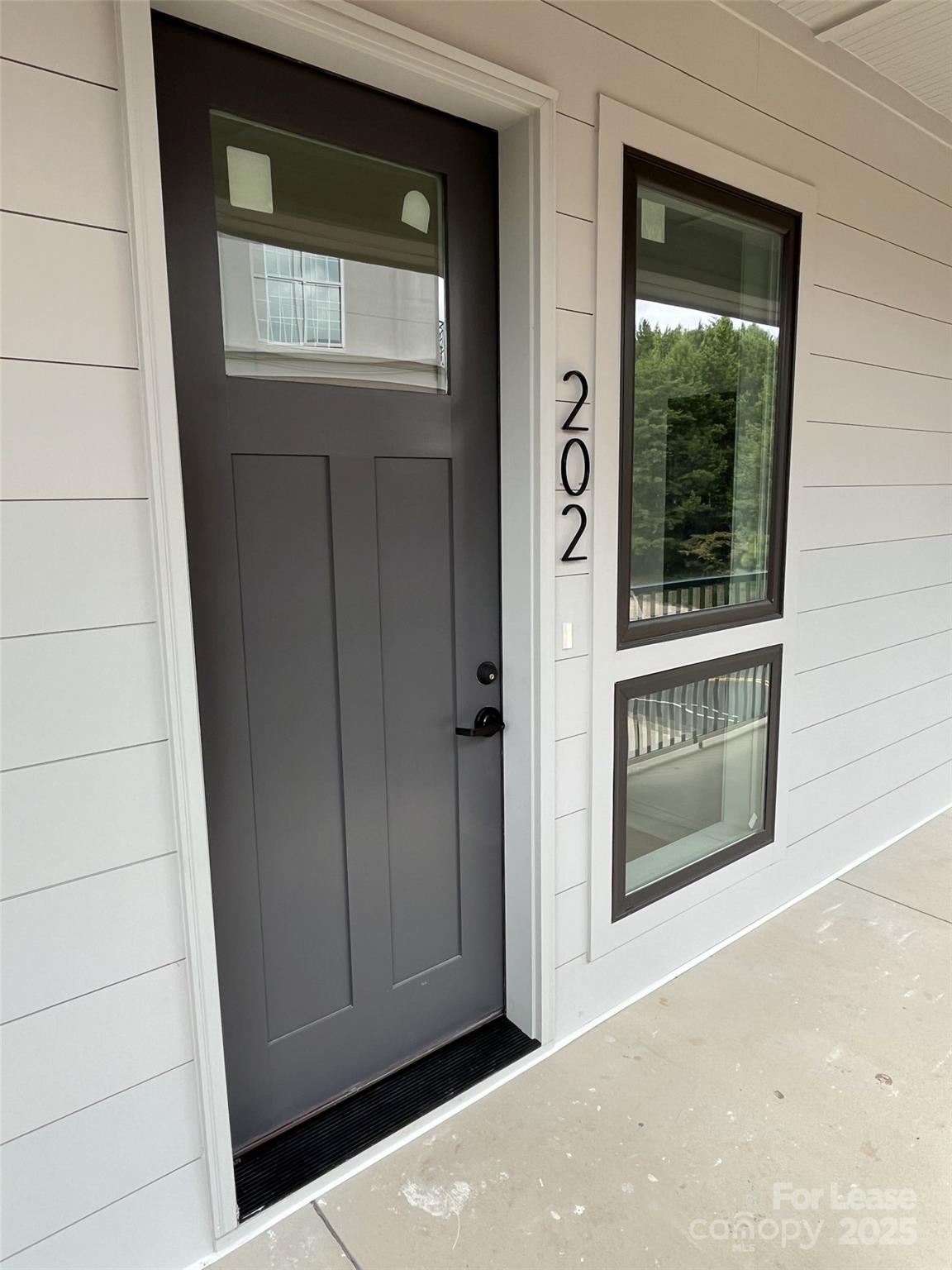 19546 Greentree Way, Unit 202 Cornelius, NC 28031 - Photo 5 of 30 a view of a door of a house