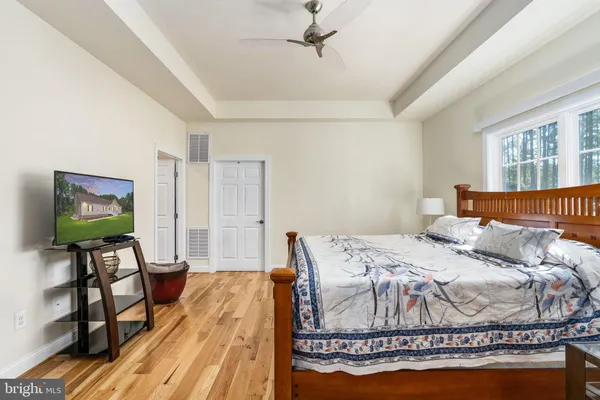 a bedroom with a bed and a table