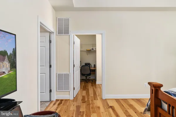 a bathroom with a granite countertop bathtub double vanity and a sink