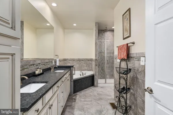 a bathroom with a sink and mirror