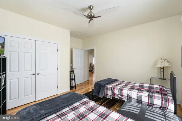 a bathroom with a granite countertop toilet sink and shower