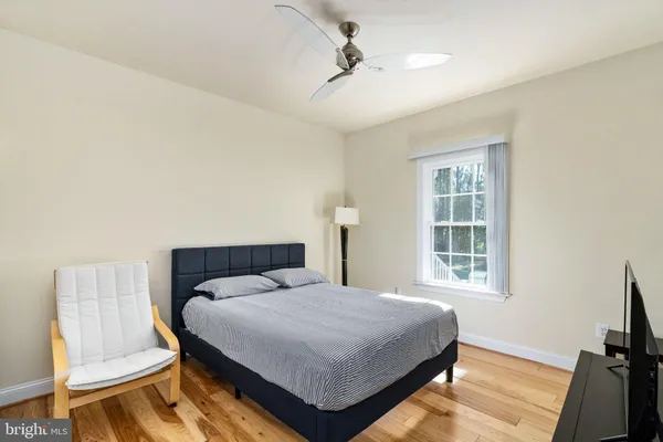 a bathroom with a toilet a sink and shower