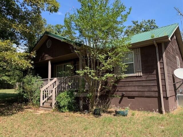 650 Howard Road Decatur, TN 37322 - Photo 1 of 20 a view of house with outdoor space and seating area