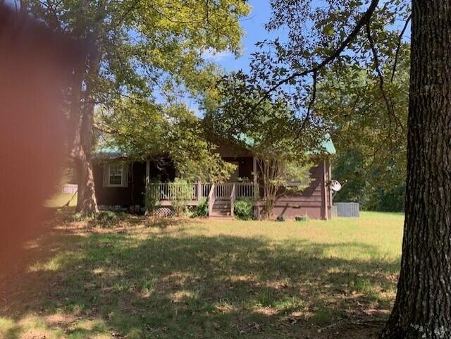 650 Howard Road Decatur, TN 37322 - Photo 4 of 20 a view of a yard with chairs and a tree