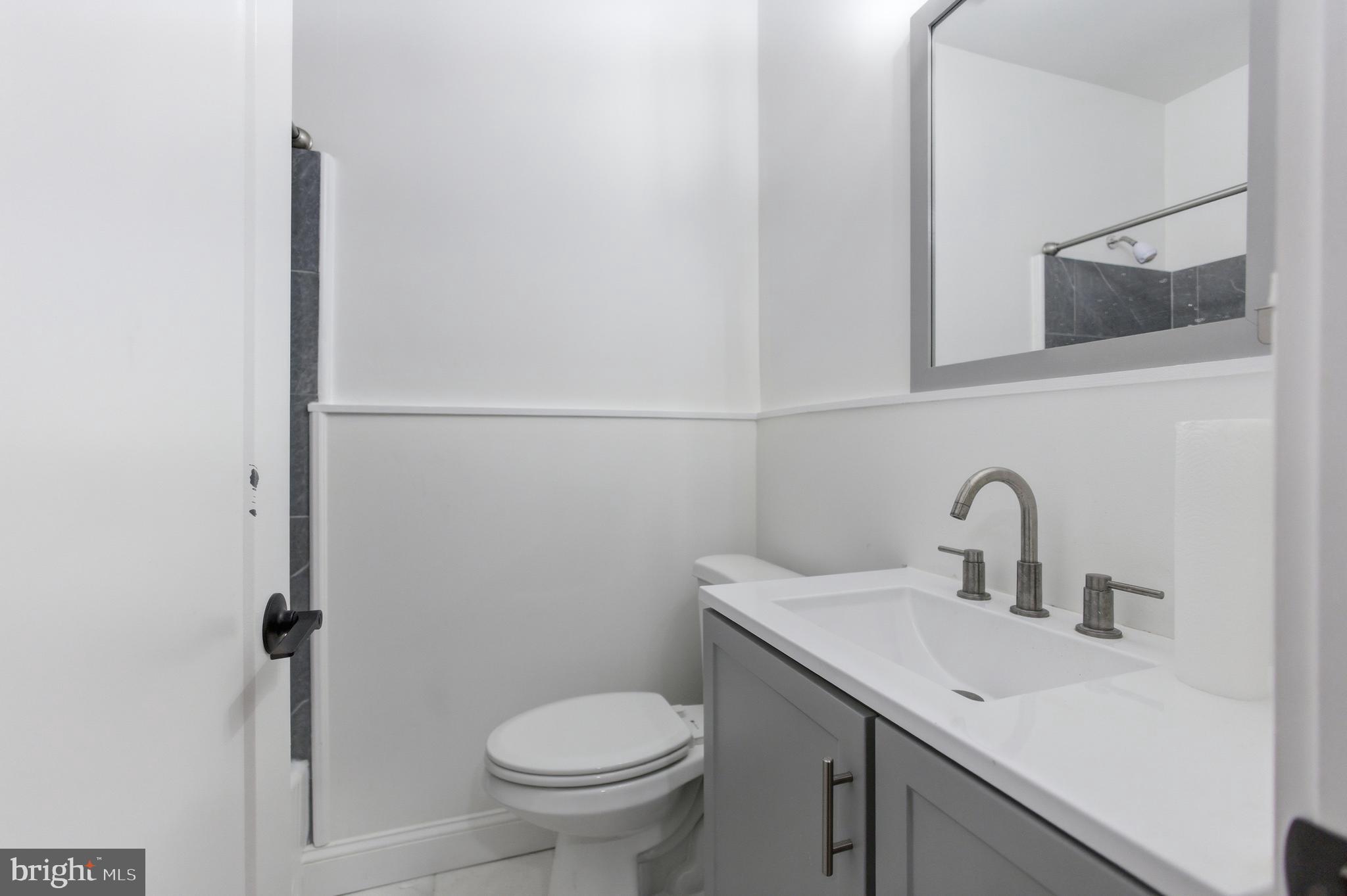 1250 Holbrook Terrace Northeast, Unit 3 Washington, DC 20002 - Photo 11 of 12 a bathroom with a sink and a toilet