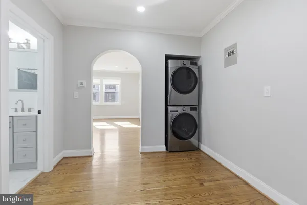 a view of a hallway with washer and dryer